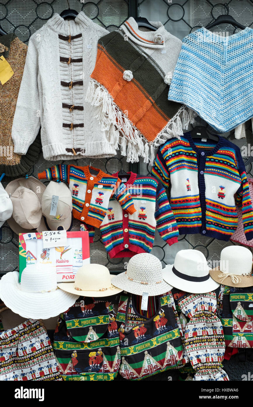 Souvenirs of Madeira hanging outside a tourist shop at Funchal Stock Photo