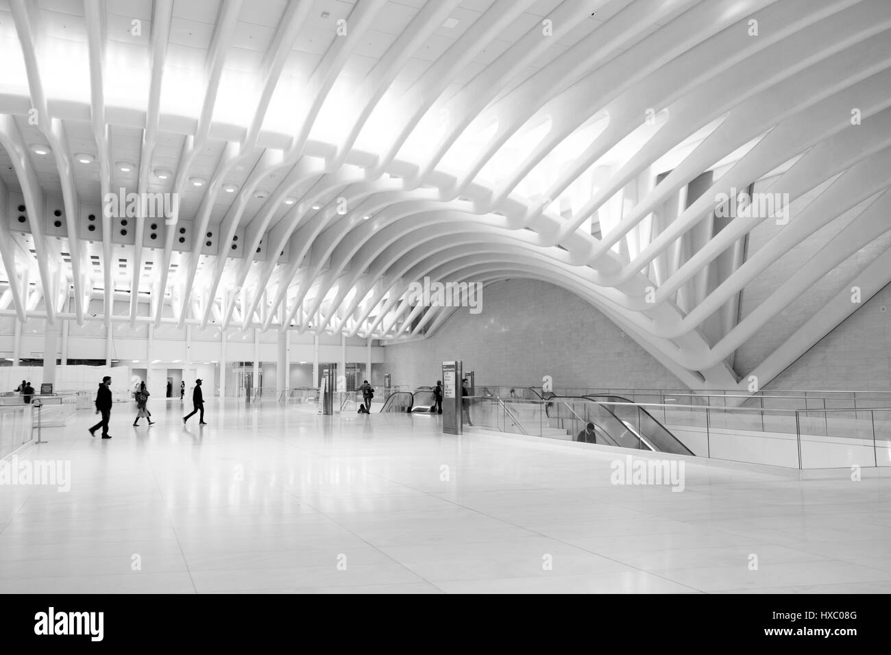 NEW YORK CITY-1 OCTOBER 2016: People walking to the escalator to board the PATH train to New Jersey inside Santiago Calatrava's Oculus,stunning new tr Stock Photo