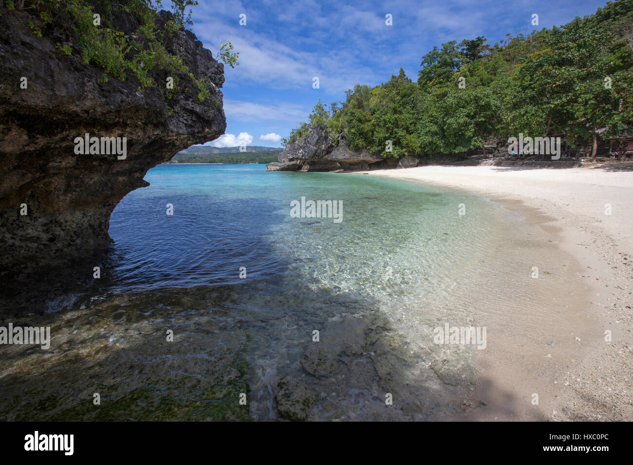 Salagdoong Beach is one of †the most popular beaches on Siquijor Island. This white sand beach located near the town of Maria is enclosed by a rocky h Stock Photo