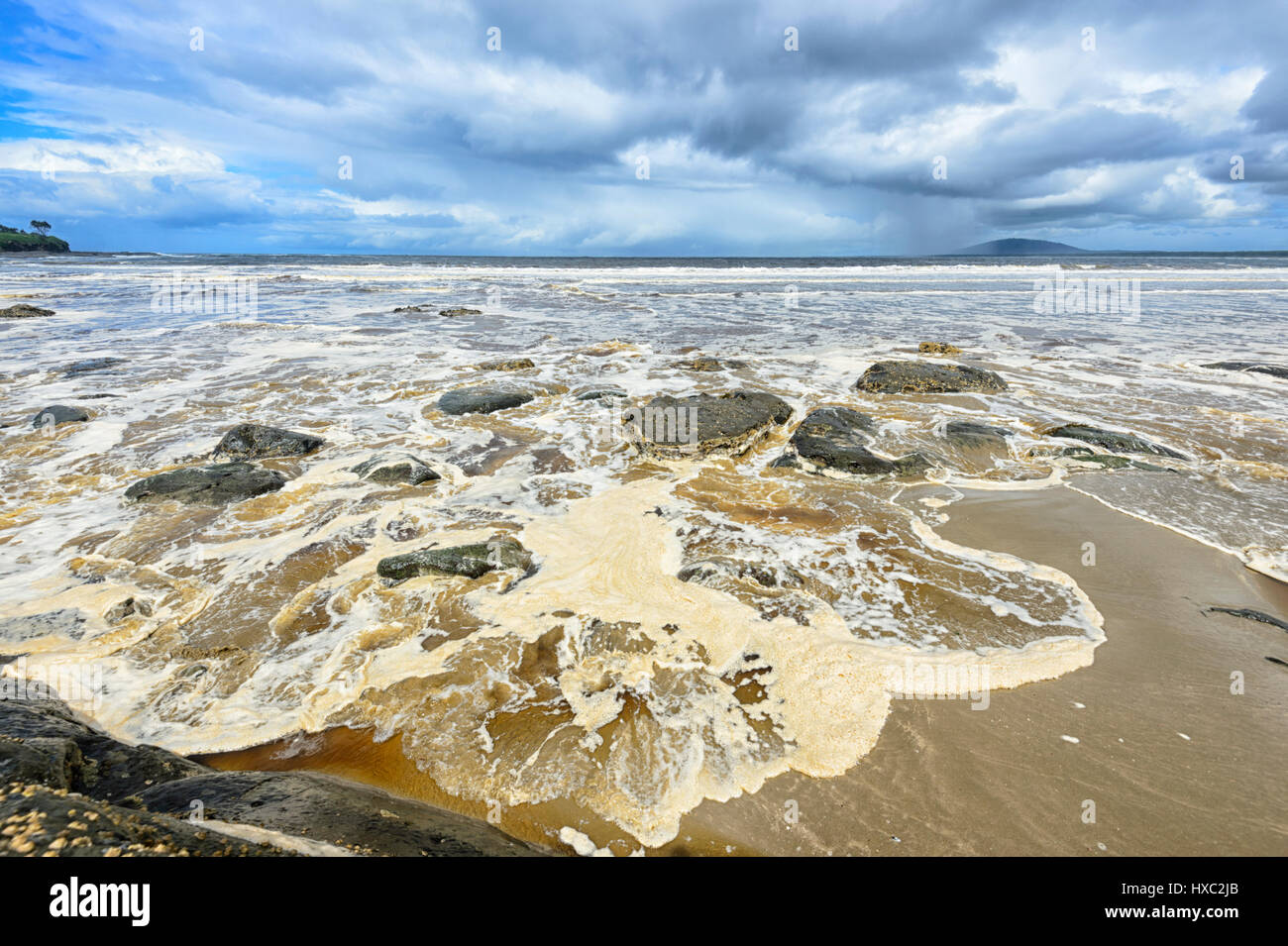 Sea Foam on the beach after a storm, Seven Mile Beach, Gerroa, Illawarra Coast, New South Wales, NSW, Australia Stock Photo
