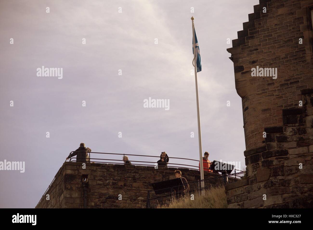 Edinburgh Castle tourist crowds on a sunny day explore the inside of the walls Stock Photo