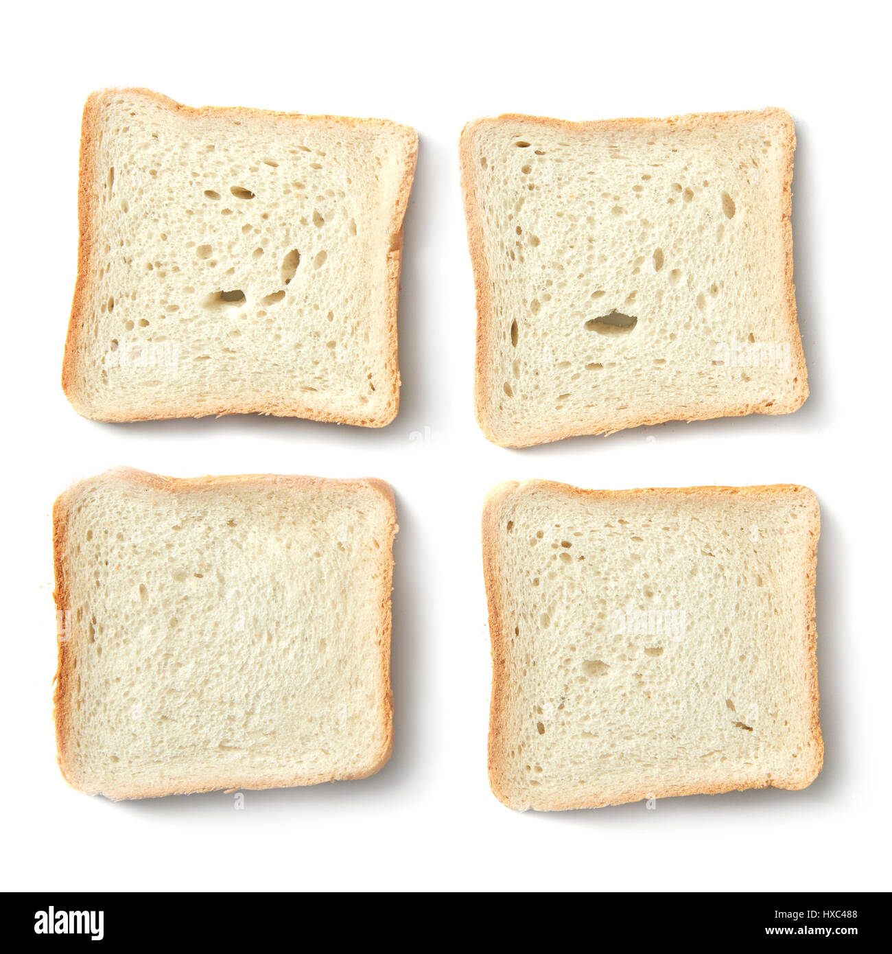 Four slices of white bread for making sandwiches over white background