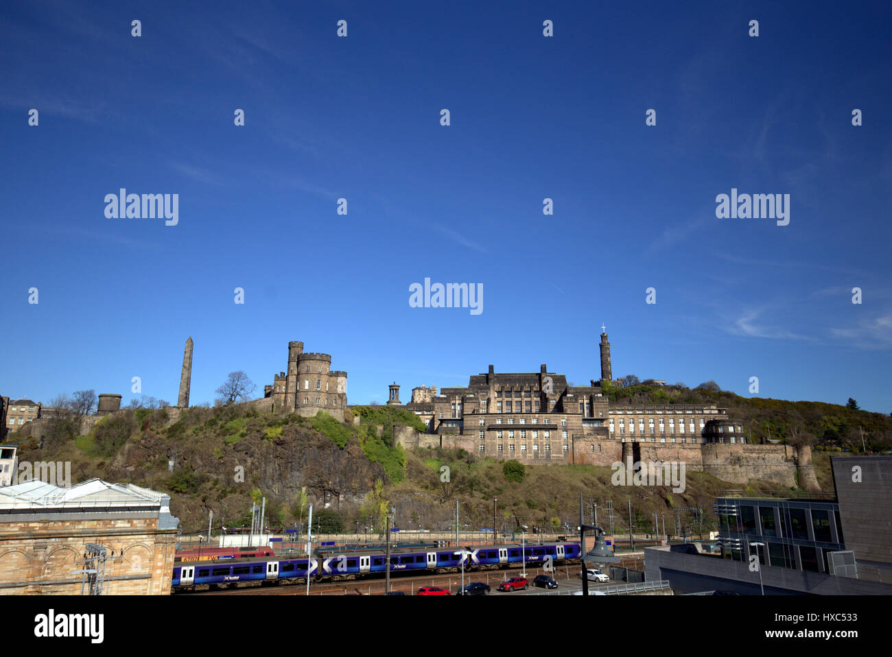 panoramic view of calton hill om a sunny day with waverley station in the foreground Stock Photo
