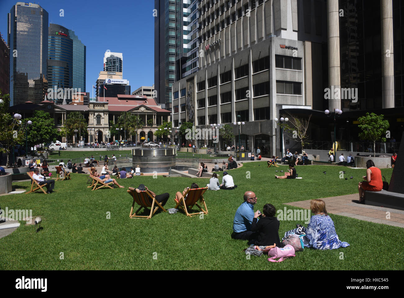 Brisbane, Australia Office workers bask in the sunshine at lunchtime