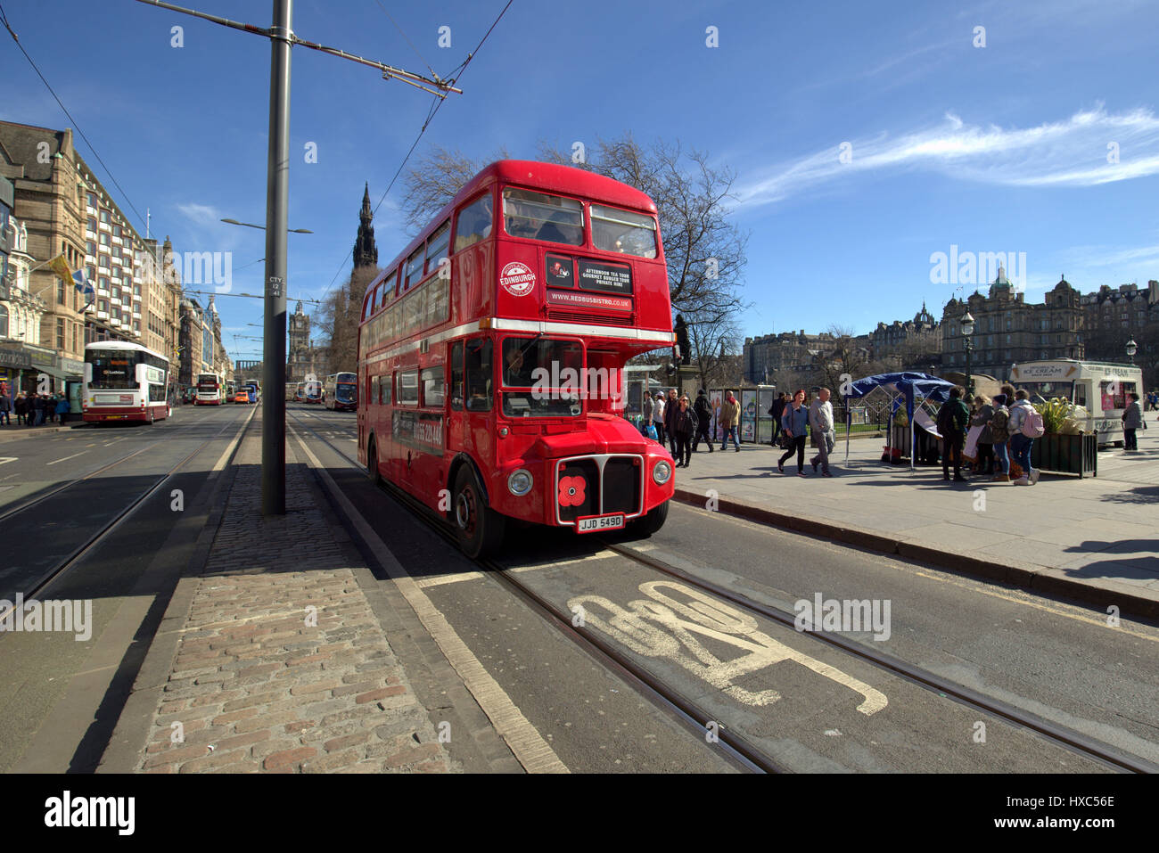 Red route master bus Princes Street Edinburgh cycle lane blue sky Stock Photo