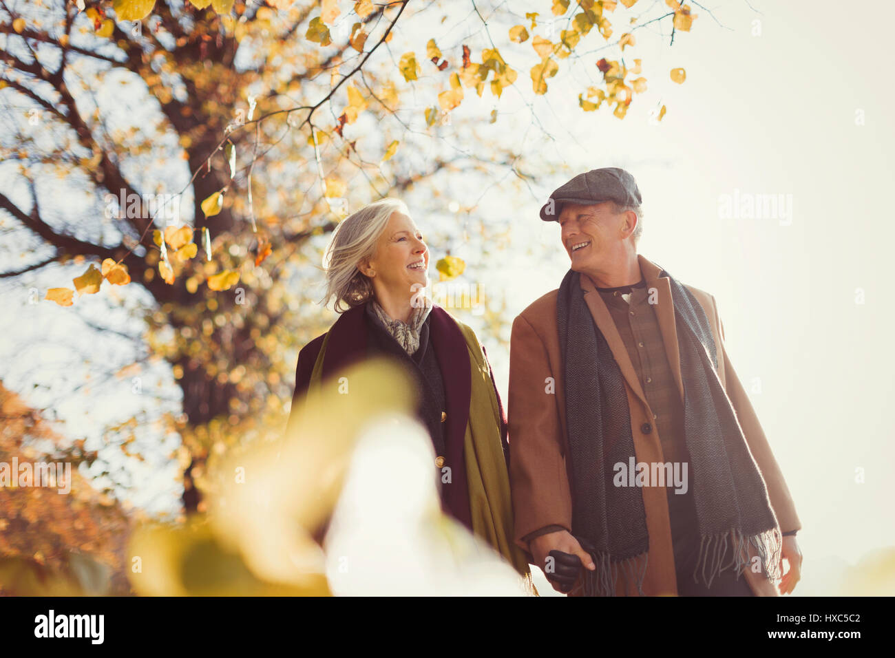 Senior woman walking in park hi-res stock photography and images - Alamy