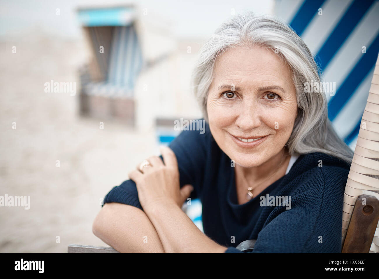 Portrait smiling senior woman on beach Stock Photo - Alamy