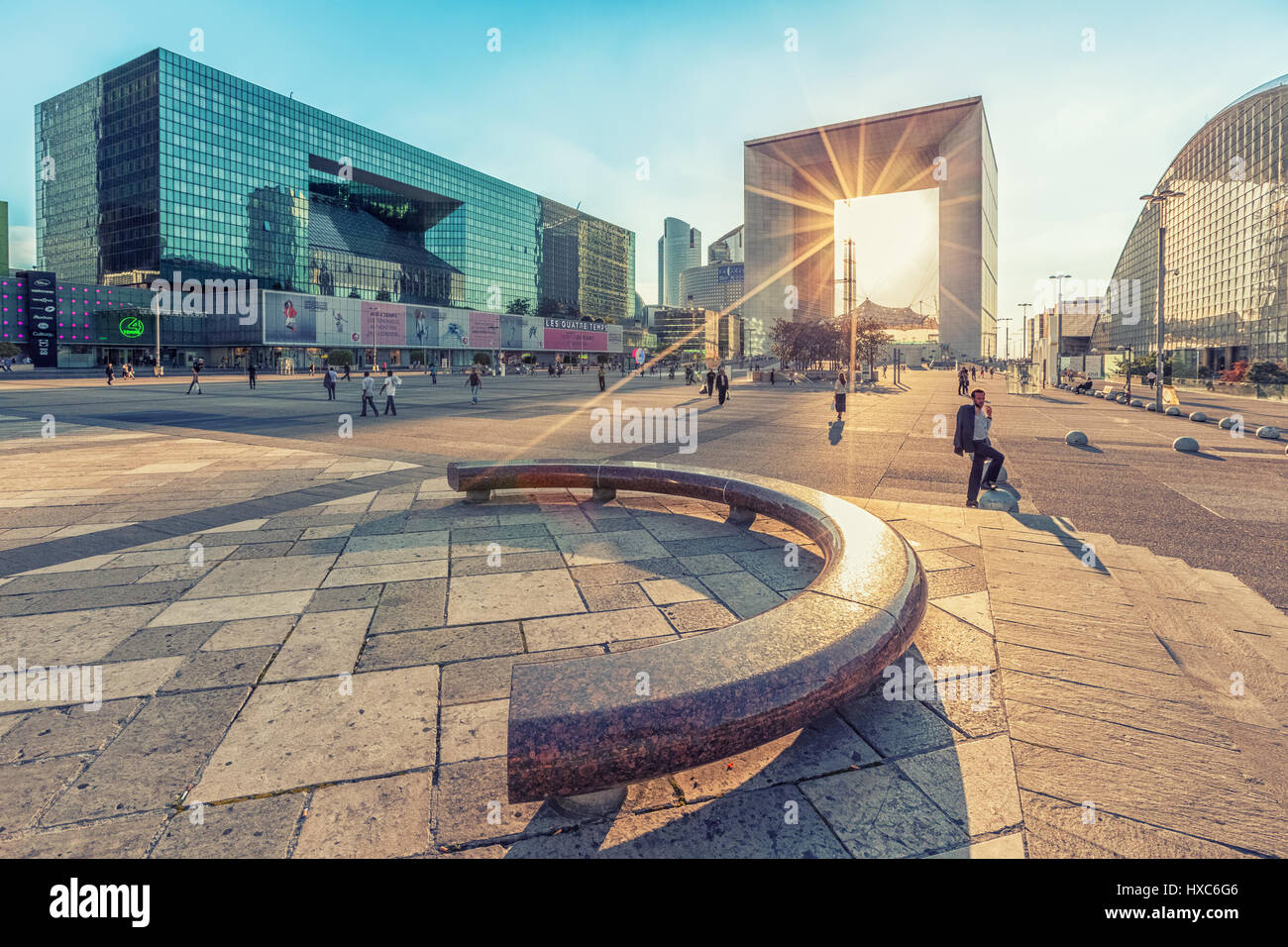 Paris, France - July 17 2014: Sun rays passing through Grande Arche building in La Defence business district Stock Photo