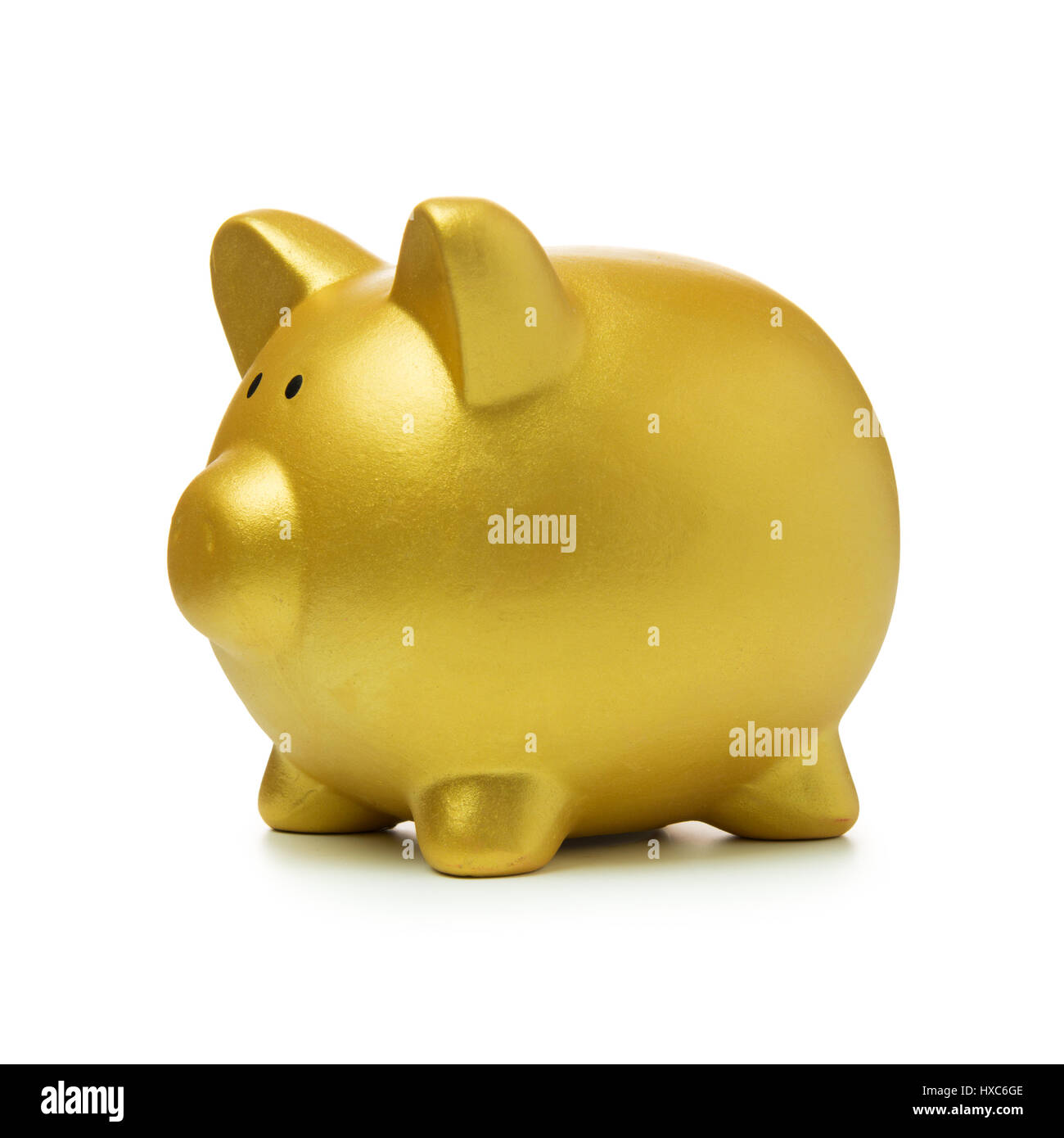 Golden color piggy bank isolated on white background Stock Photo - Alamy