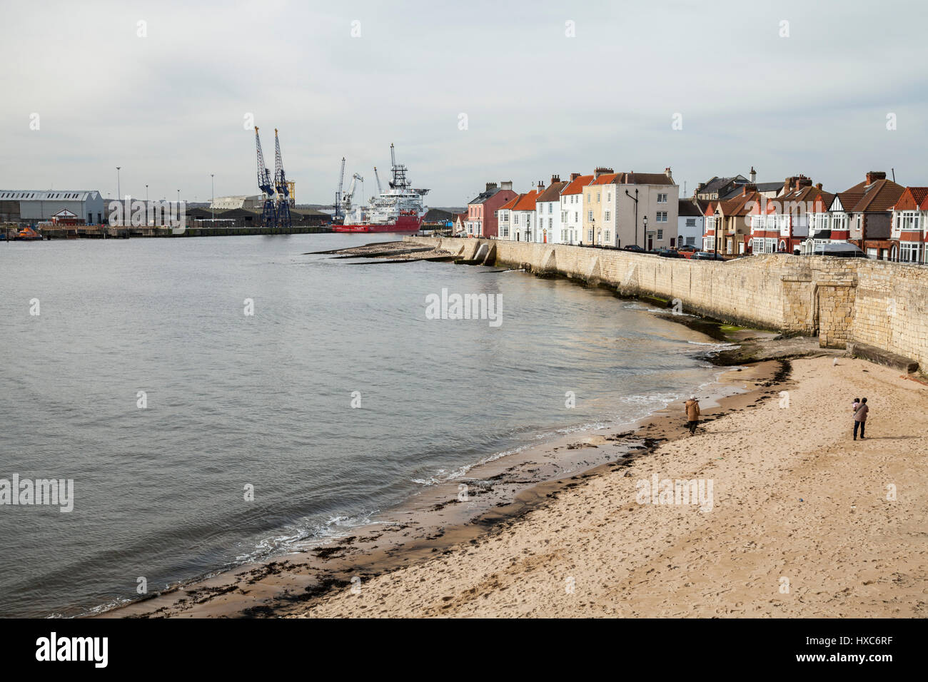 The sea front at Hartlepool Headland featuring the beach,houses and