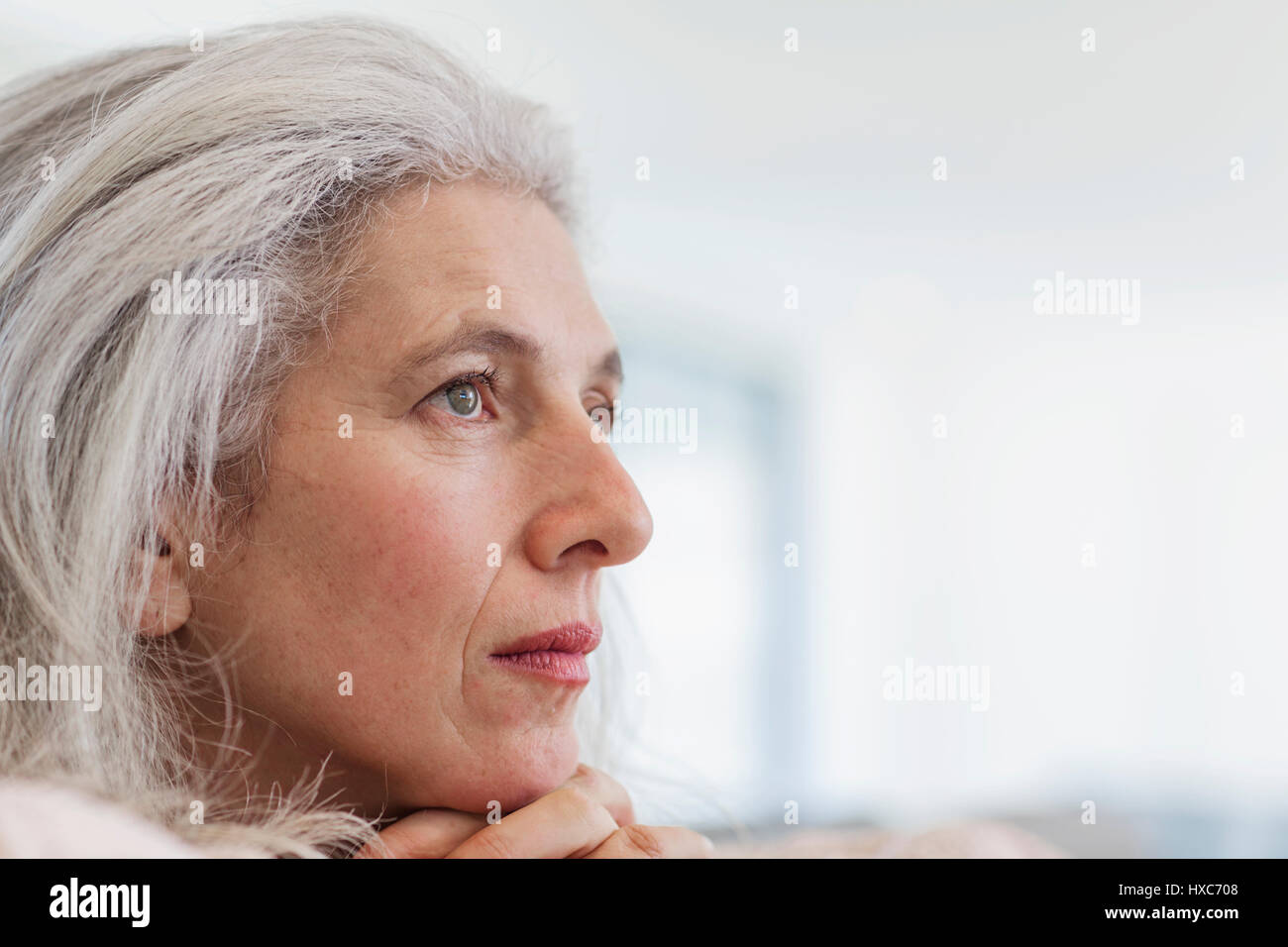 Pensive mature woman hi-res stock photography and images - Alamy