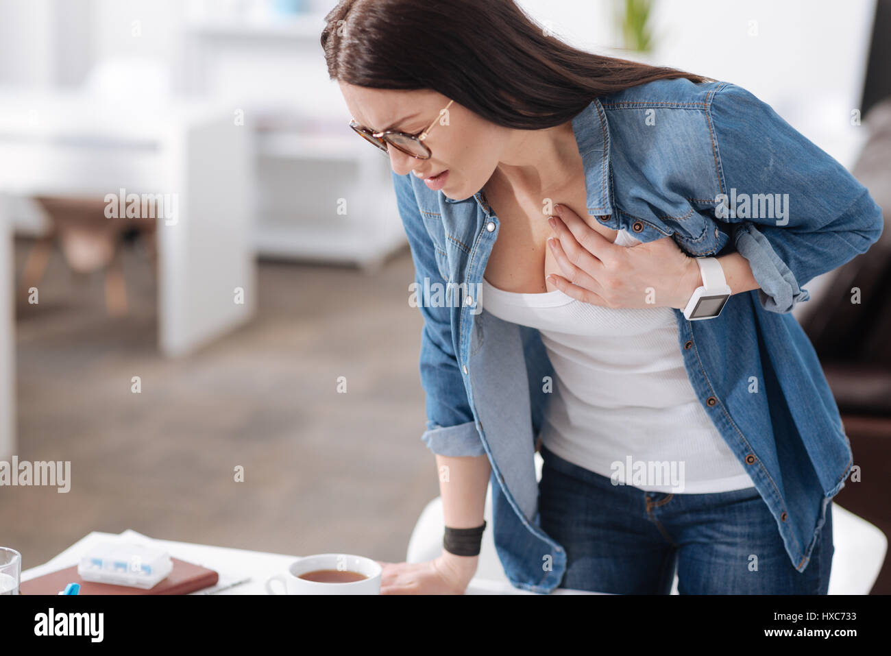 Young woman having health problems Stock Photo