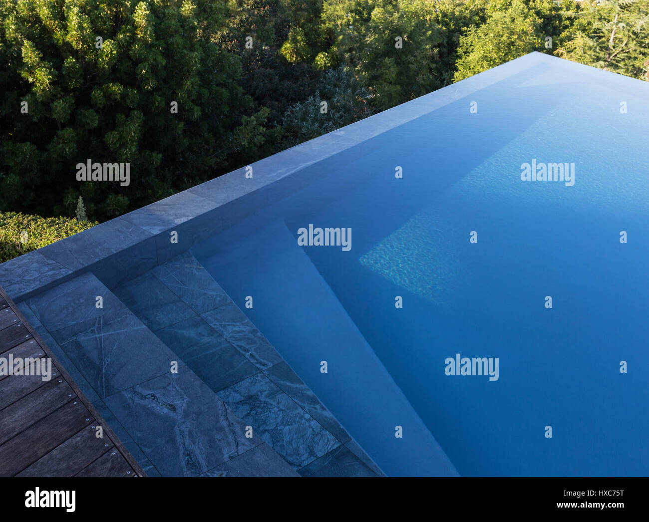Modern blue geometric luxury infinity pool Stock Photo