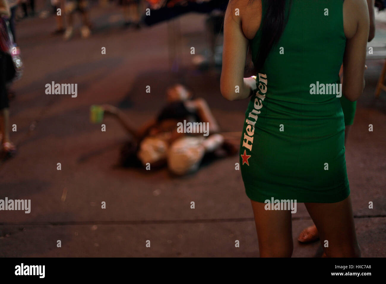 A Heineken beer promo lady in a short dress somewhere in Thailand. Stock Photo