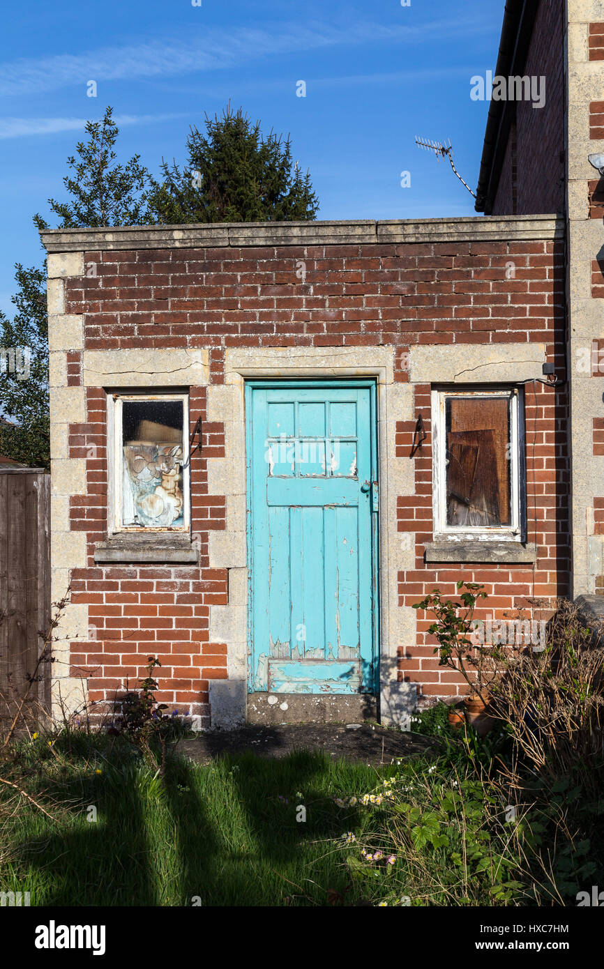 Building with colour teal door in Exeter Devon Stock Photo