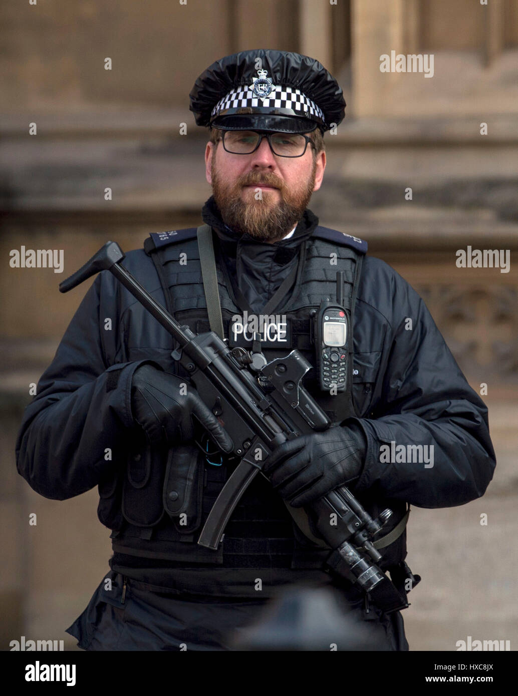 An armed police officer outside the Palace of Westminster, London Stock ...