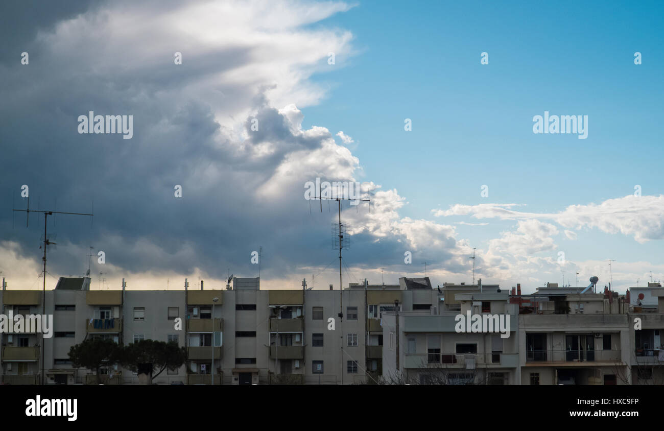Cityscape with cloudy sky. Stock Photo