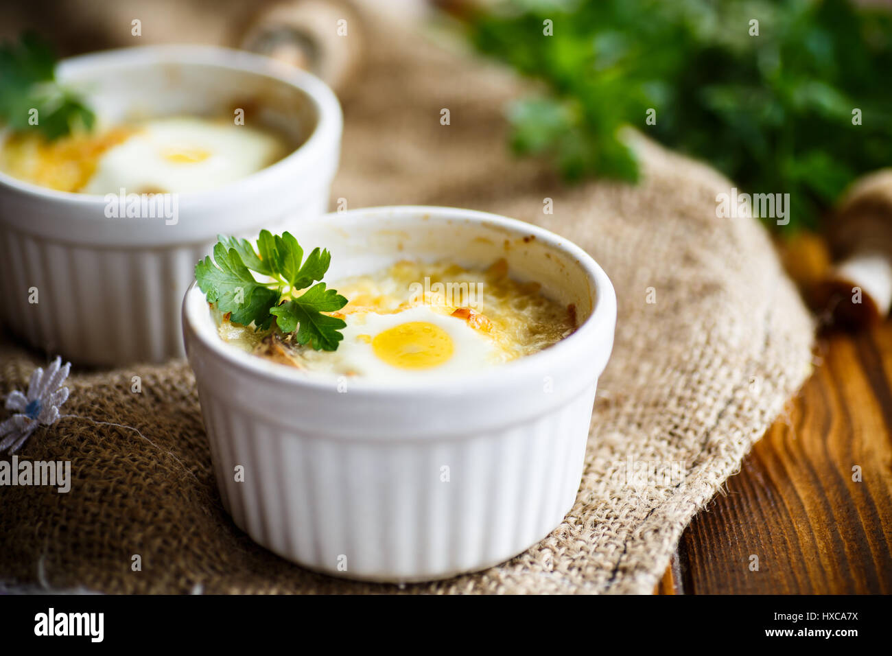 Baked egg with minced fish and mushrooms Stock Photo