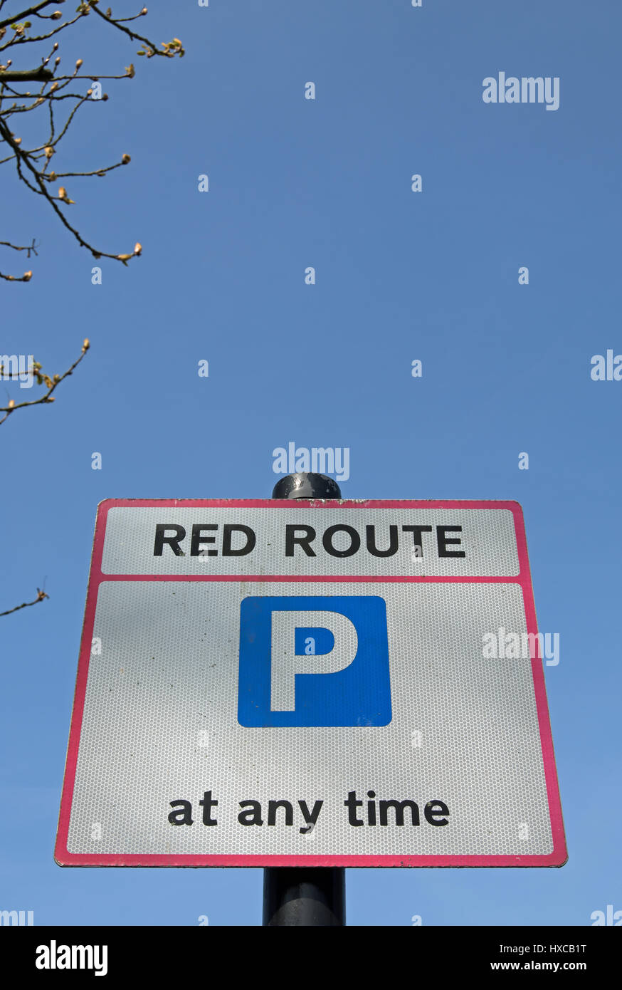 british road sign denoting a red route with parking allowed at any time
