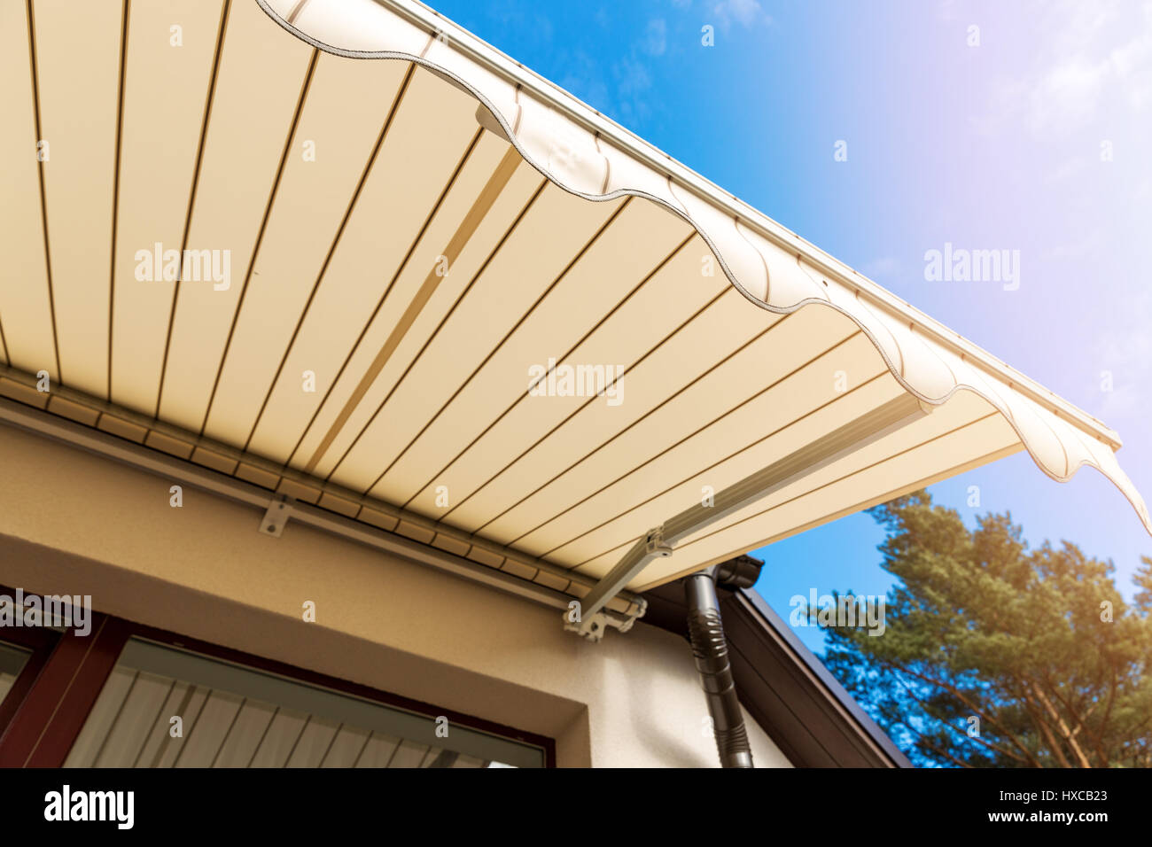 awning over balcony window against blue sky Stock Photo