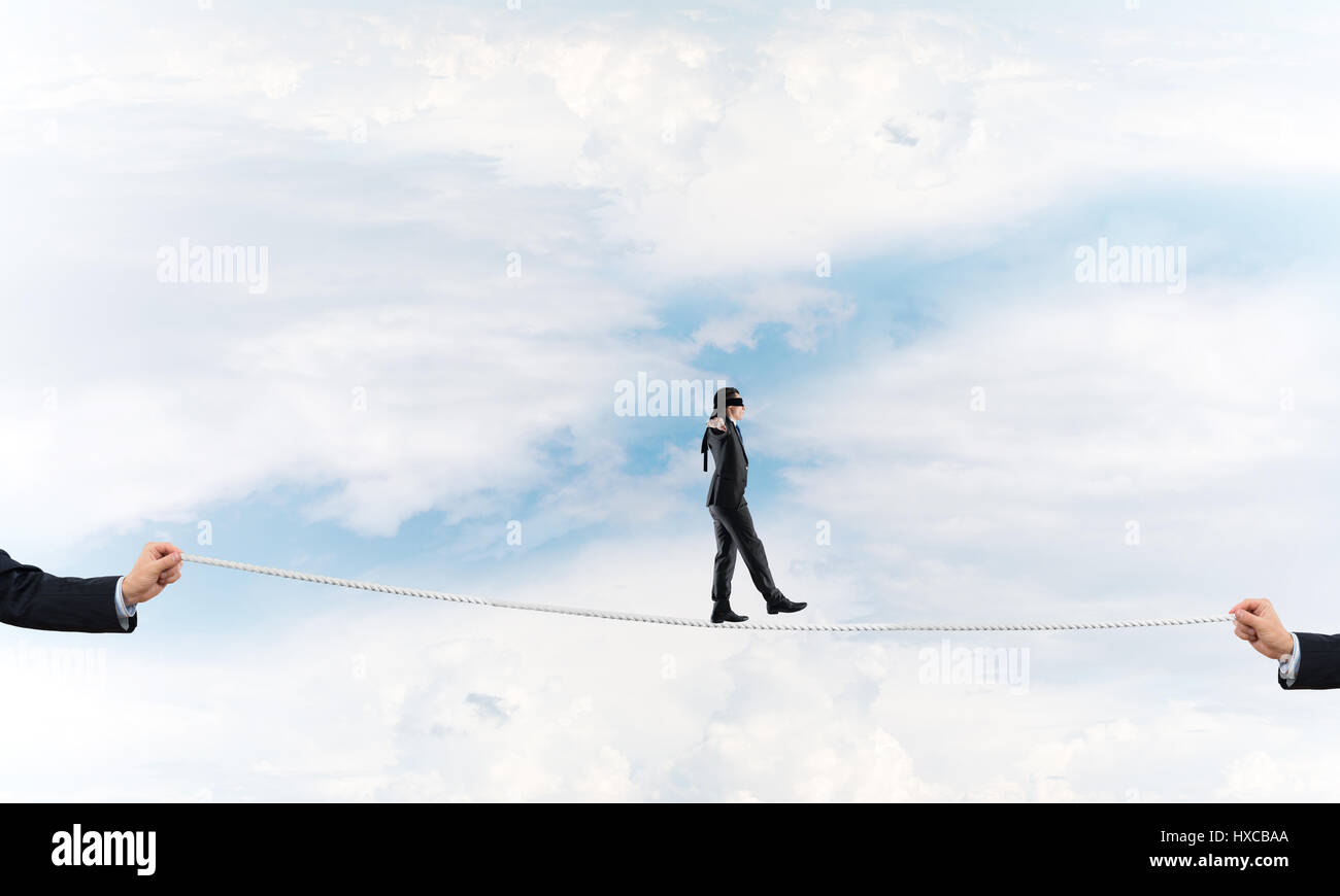 Business concept of risk support and assistance with man balancing on ...