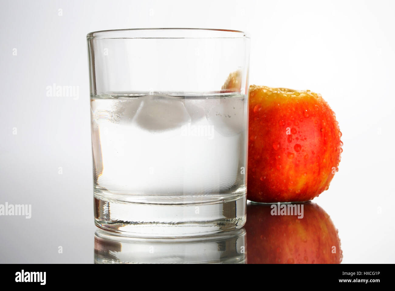 Glass of water with apple, Glas Wasser mit Apfel Stock Photo