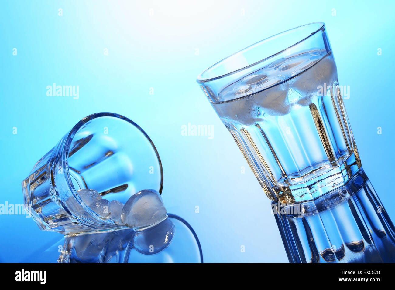 Water glasses with ice cube, Wasserglaeser mit Eiswuerfel Stock Photo