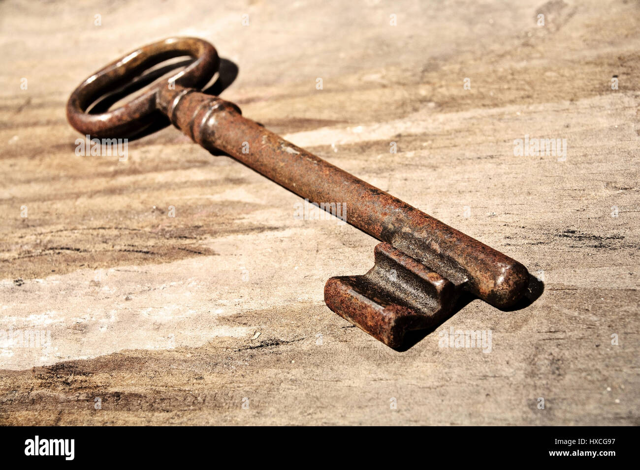 Old key on a wooden table, Old key on a wooden table |, Alter Schluessel auf einem Holztisch |Old key on a wooden table| Stock Photo