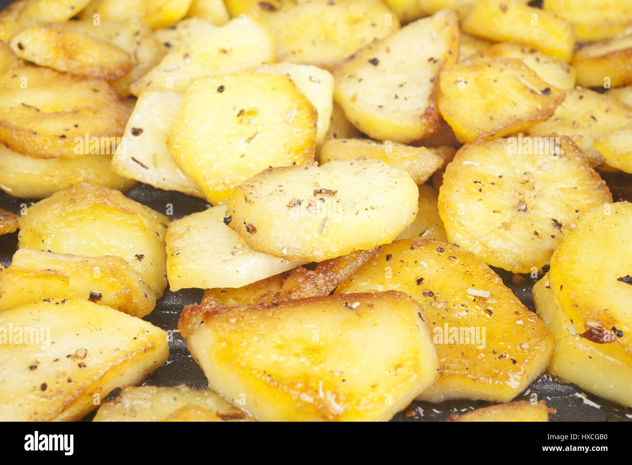 Fried potatoes in a frying pan, Fried potatoes in a pan |, Bratkartoffeln in einer Pfanne |Fried potatoes in a pan| Stock Photo