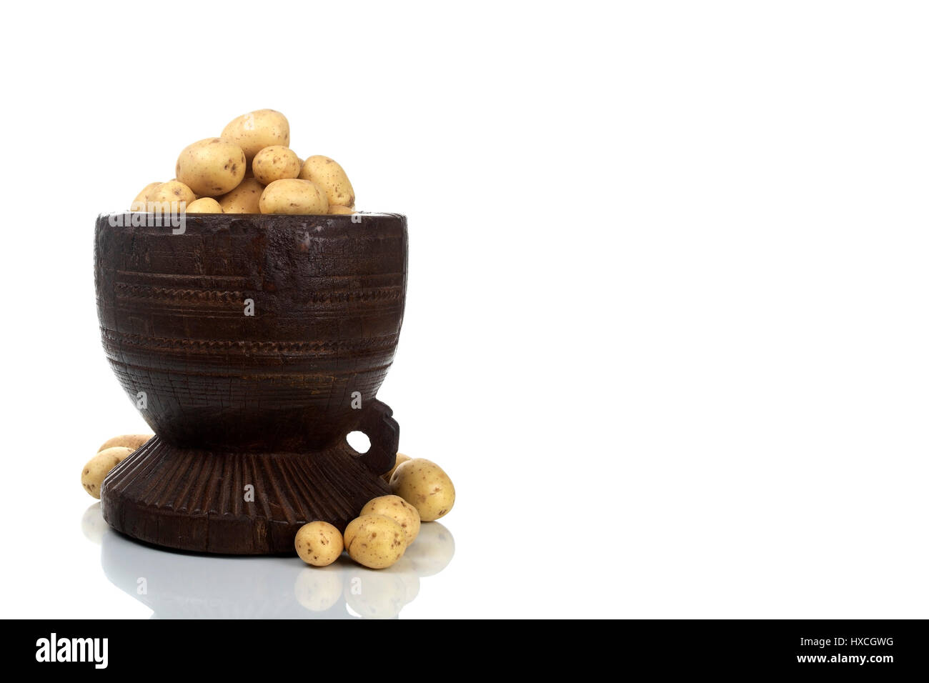 Wooden bowl with potatoes, Holzschale mit Kartoffeln Stock Photo