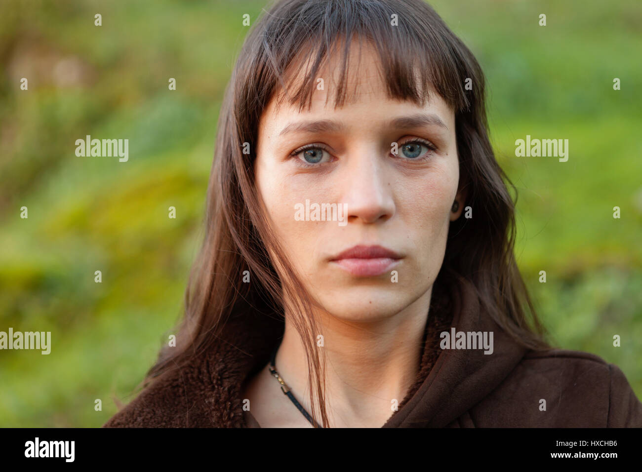 Beautiful woman with blue eyes in the park Stock Photo Alamy