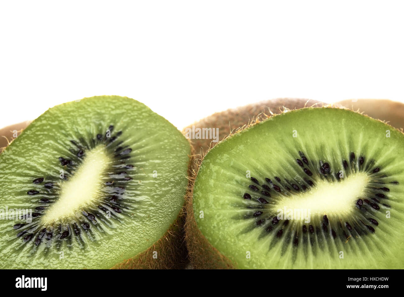 Cut open kiwi fruits, Aufgeschnittene Kiwi-Fruechte Stock Photo