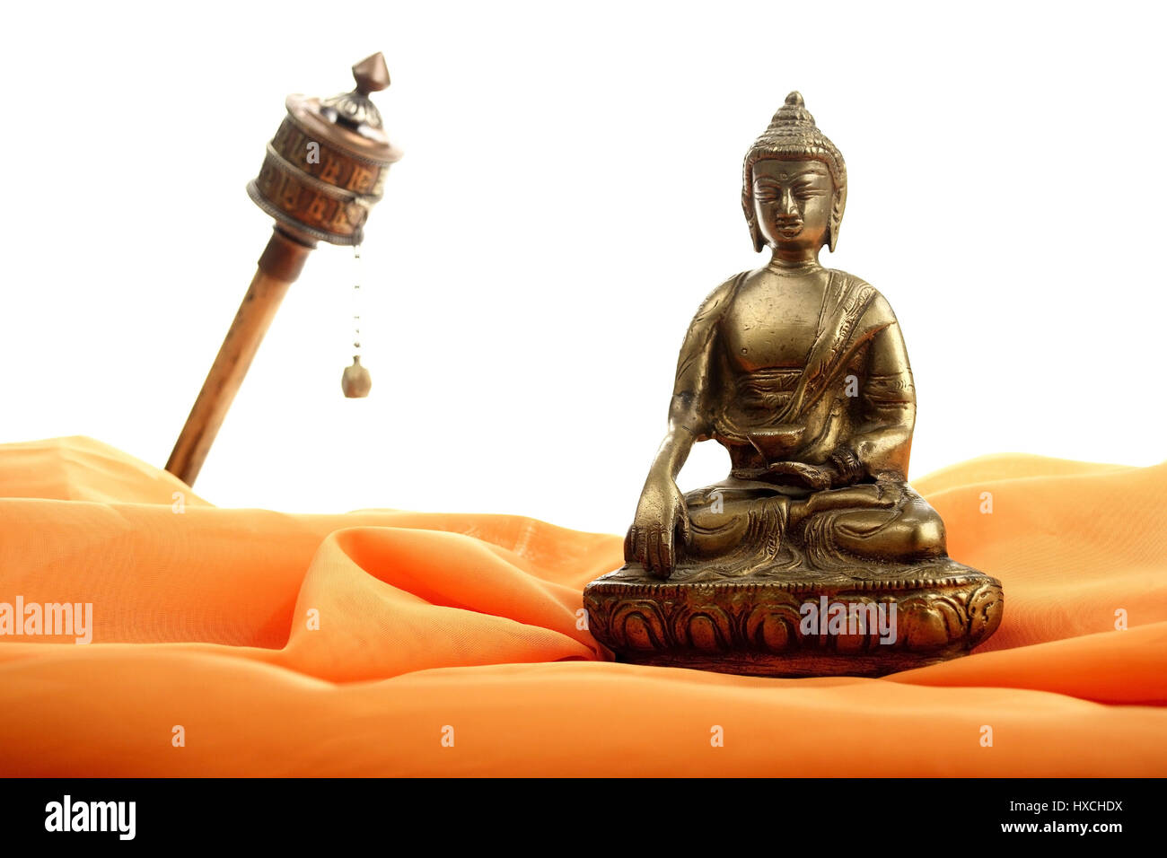 Buddha's statue and prayer mill, Buddhastatue und Gebetsmühle Stock Photo