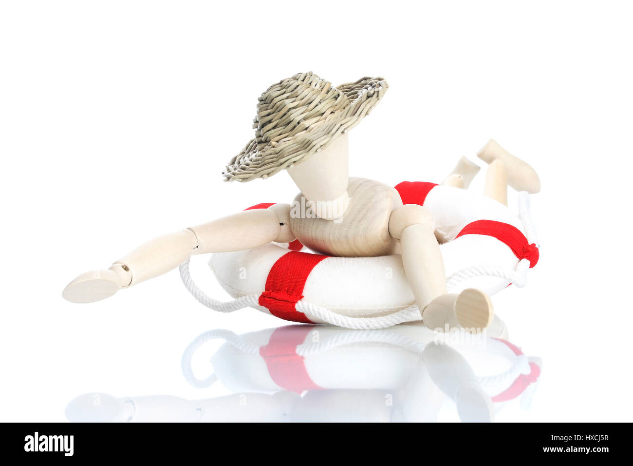 Wooden doll with life preserver, Holzpuppe mit Rettungsring Stock Photo