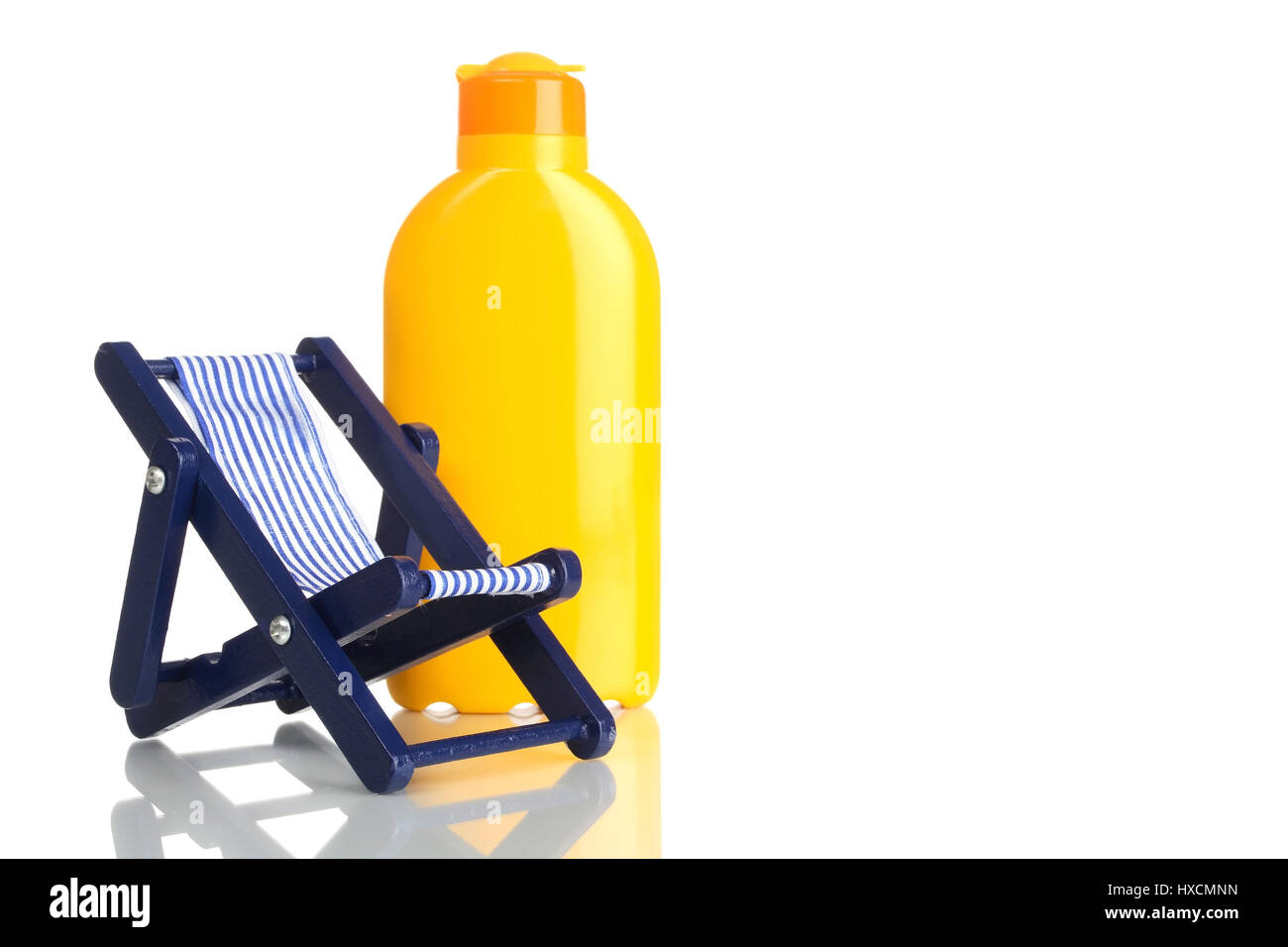 Deck chair with solar cream, Liegestuhl mit Sonnencreme Stock Photo