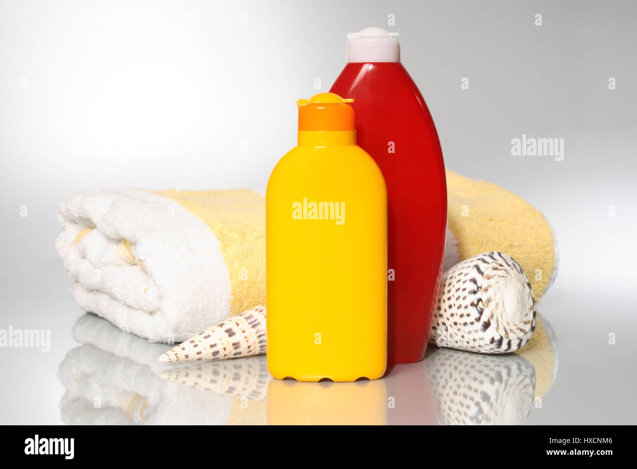 Bath sheets with solar milk and lotion, Badelaken mit Sonnenmilch und Lotion Stock Photo