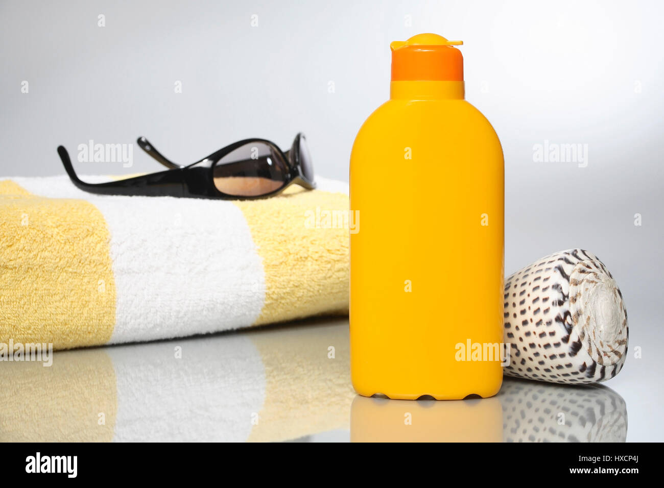 Sunglasses, towel and solar milk, Sonnenbrille, Handtuch und Sonnenmilch Stock Photo