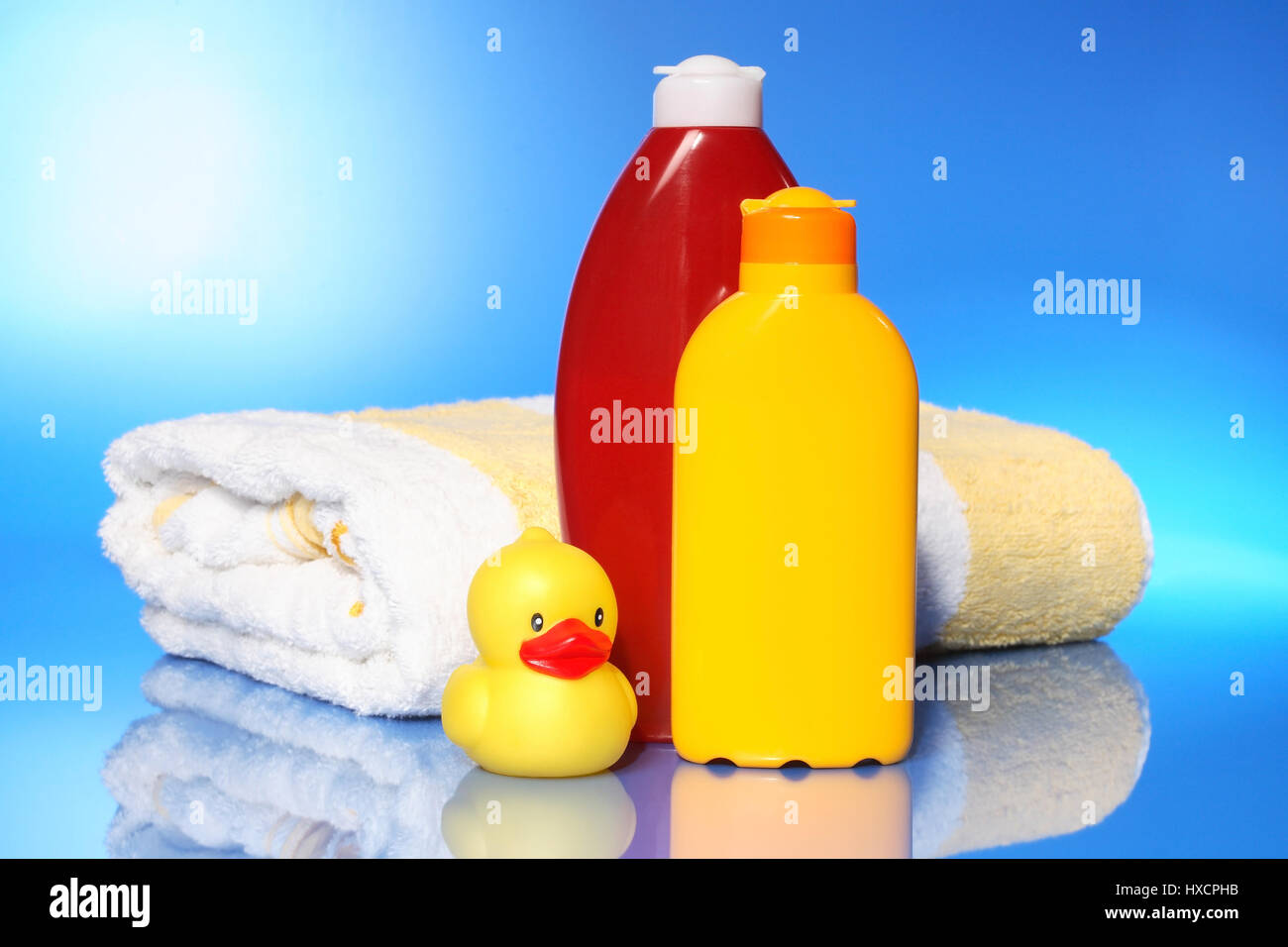 Bath sheets with solar milk and elastic duck, Badelaken mit Sonnenmilch und Gummiente Stock Photo