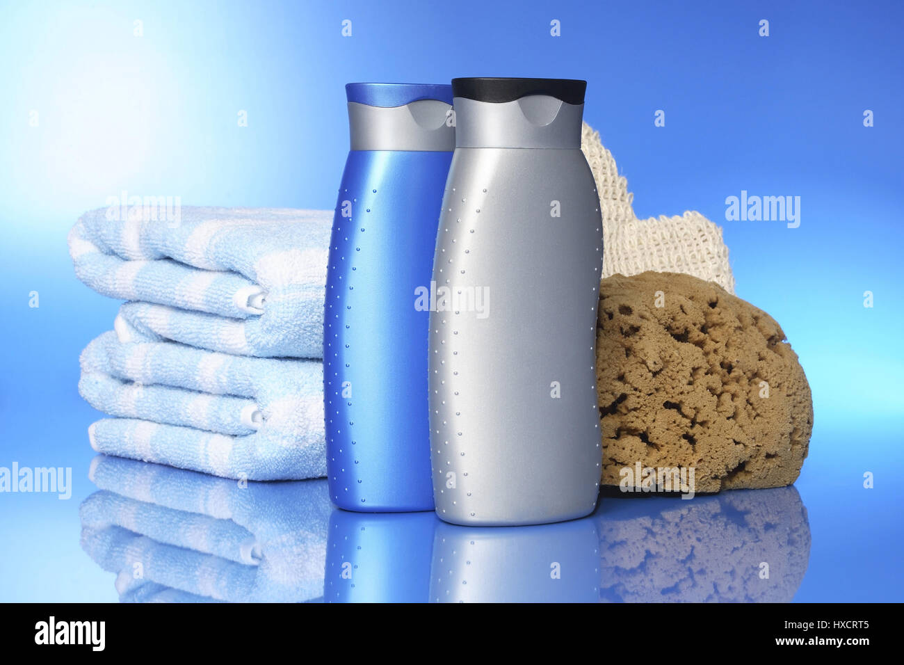 Shower gel with towel and sponge, Duschgel mit Handtuch und Schwamm Stock Photo