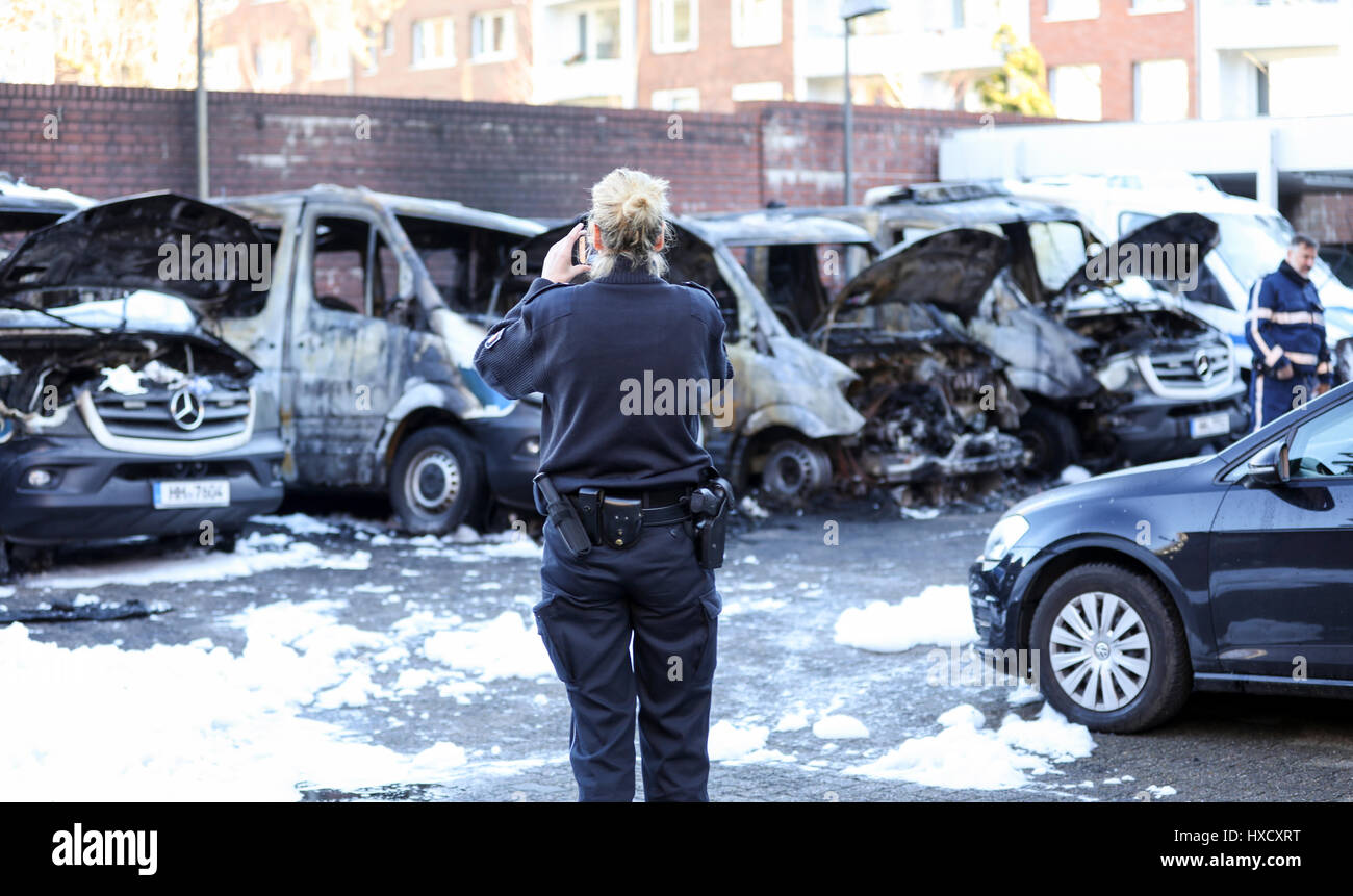 Hamburg, Germany. 27th Mar, 2017. Burned out pulps of police vehicles can be seen in Hamburg, Germany, 27 March 2017. A total of six police cars were set on fire on sunday evening. The investigators are checking if the fire was politically motivated, especially concerning the protest leading up to the G20 summit on the 7th and 8th July. Photo: Christian Charisius/dpa/Alamy Live News Stock Photo