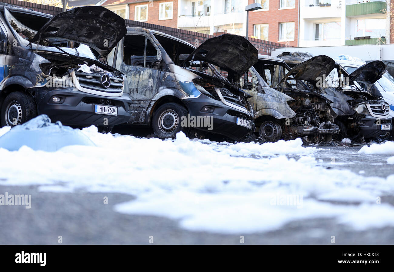 Hamburg, Germany. 27th Mar, 2017. Burned out pulps of police vehicles can be seen in Hamburg, Germany, 27 March 2017. A total of six police cars were set on fire on sunday evening. The investigators are checking if the fire was politically motivated, especially concerning the protest leading up to the G20 summit on the 7th and 8th July. Photo: Christian Charisius/dpa/Alamy Live News Stock Photo