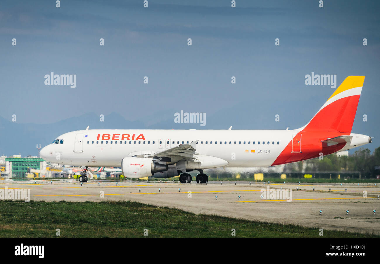 Milan, Italy. 27th Mar, 2017. An Iberia commercial airplane takes off from Milan's Linate airport. Linate is a main hub for Alitalia servicing many short and medium range destinations Credit: Alexandre Rotenberg/Alamy Live News Stock Photo