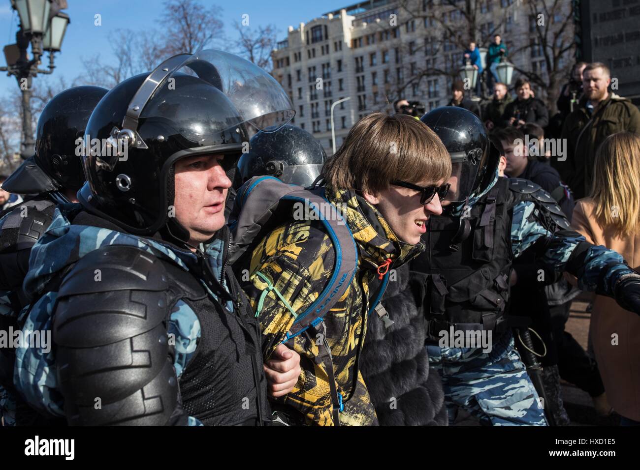 Moscow, Russia. 26th Mar, 2017. Police arrests a man during an anti-corruption protest in Moscow, Russia, on March 26, 2017. Russian law enforcement agencies acted properly during Sunday's 'unauthorized' protest, during which hundreds of participants were detained, the Kremlin said Monday. Official data showed that about 7,000-8,000 people took to the street in downtown Moscow on Sunday in a protest against corruption. Police detained some 500 people during the demonstration. Credit: Wu Zhuang/Xinhua/Alamy Live News Stock Photo