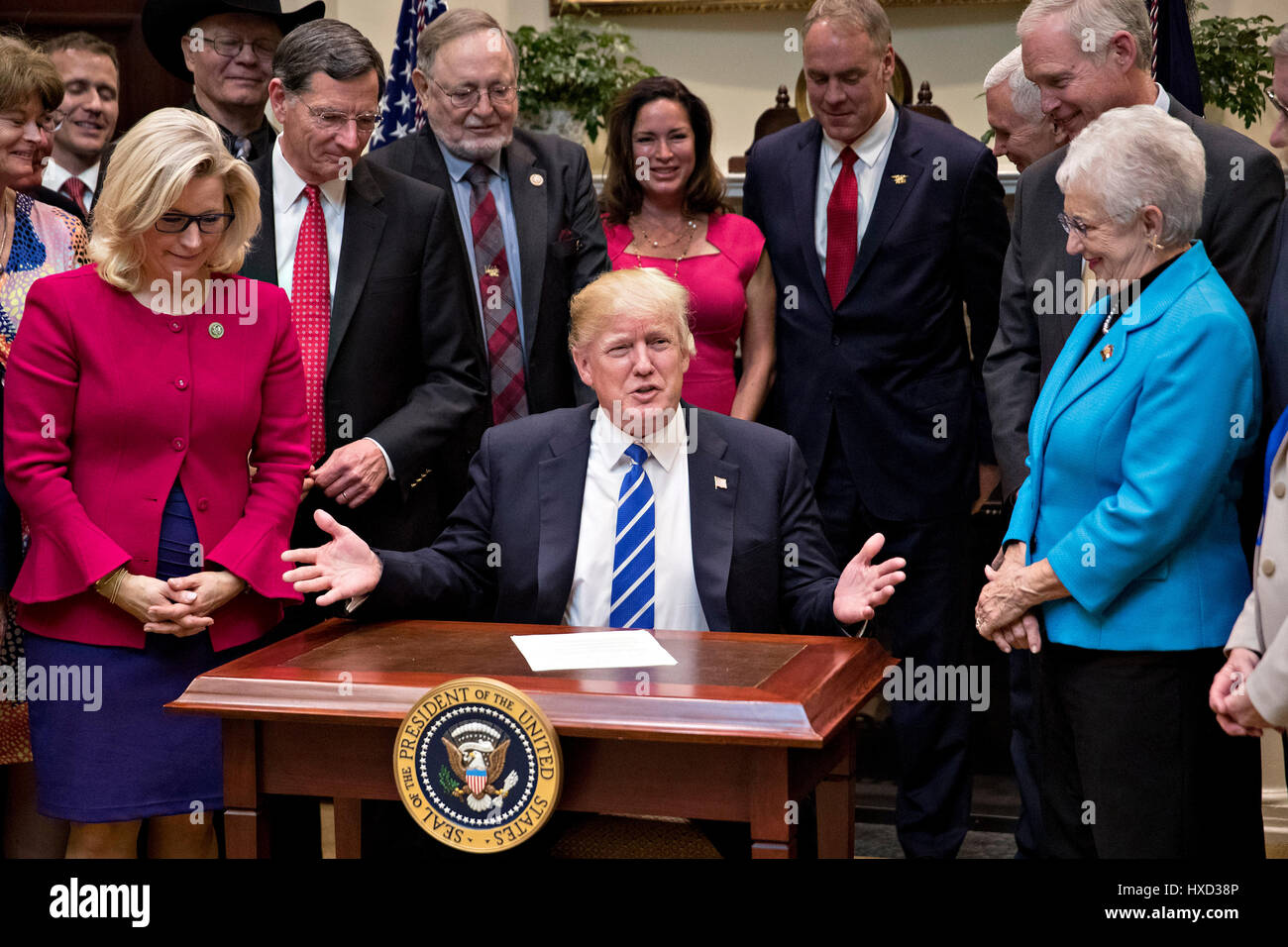 Washington DC, USA. 27th March, 2017. United States President Donald Trump speaks during a bill signing ceremony in the Roosevelt Room of the White House in Washington, DC, U.S., on Monday, March 27, 2017. Trump signed four bills, H.J. Res 37, H.J. Res 44, H.J. Res. 57 and H.J. Res. 58, that nullify measures put in place during former President Barack Obama's administration. Credit: MediaPunch Inc/Alamy Live News Stock Photo