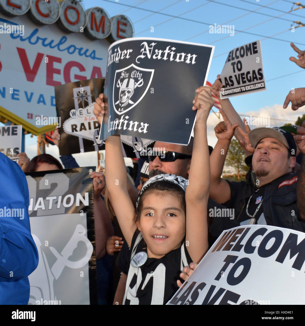 Las Vegas, Nevada, USA. 27th Mar, 2017. Las Vegas Raiders fans hold a rally at the iconic Welcome To Las Vegas Sign on March 27, 2017 to celebrate the NFL decision to approve the Oakland Raiders Football Team relocation to Las Vegas Nevada Credit: Marcel Thomas/ZUMA Wire/Alamy Live News Stock Photo