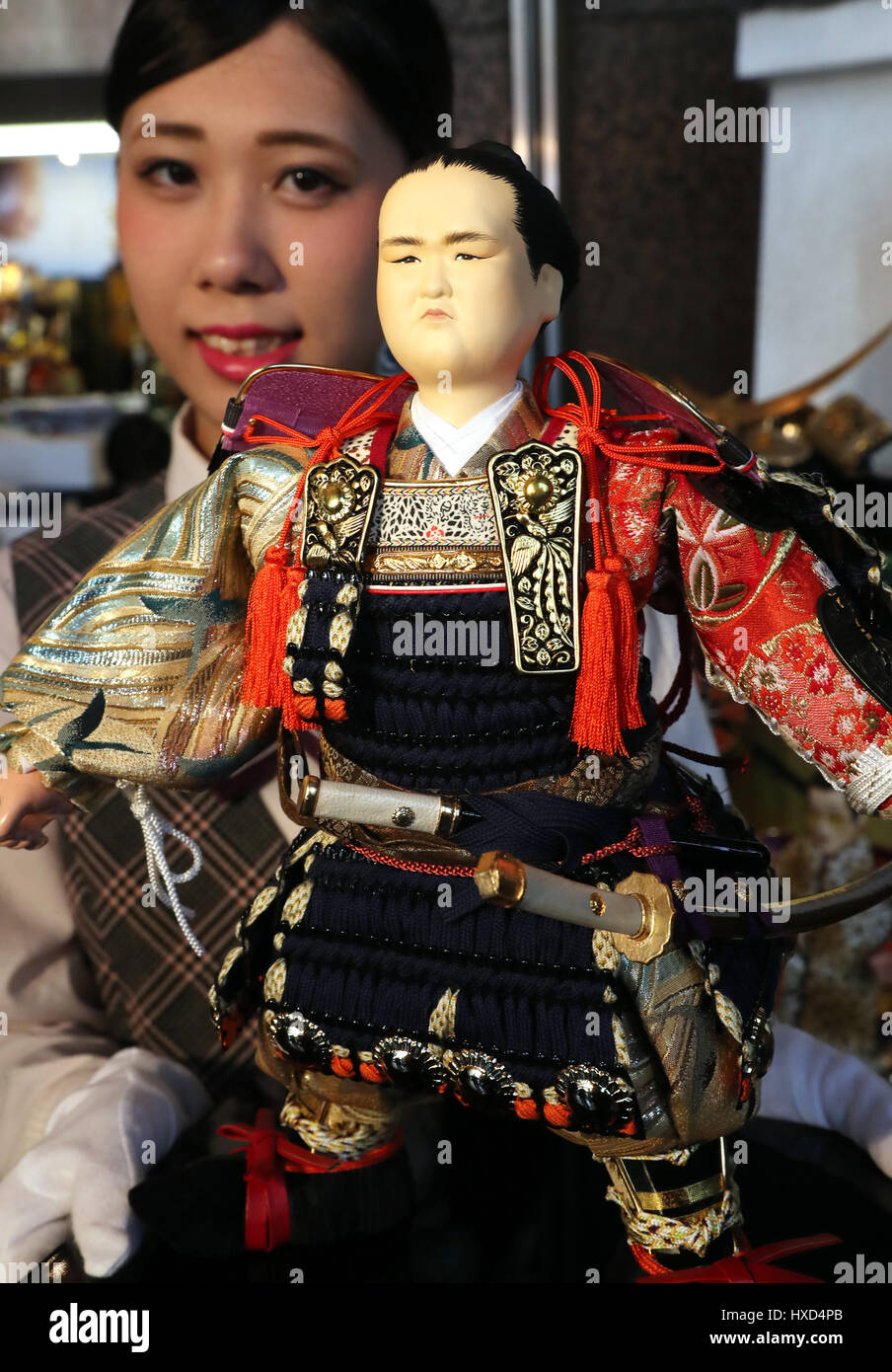 Tokyo, Japan. 28th Mar, 2017. Japanese doll maker Kyugetsu unveils a samurai doll of sumo grand