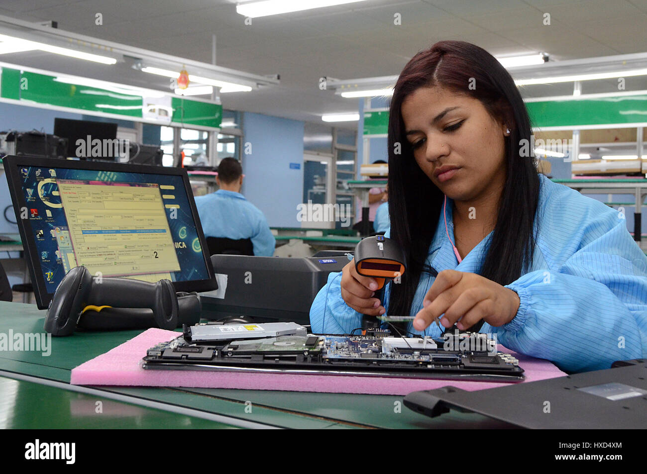 Havana. 20th Mar, 2017. Image taken on March 20, 2017 shows a woman working at a national laptop and tablet factory in Havana, Cuba. On the outskirts of Havana, the brand new assembly plant is helping to propel this long-languishing Caribbean country into the 21st century. Credit: Joaquin Hernandez/Xinhua/Alamy Live News Stock Photo