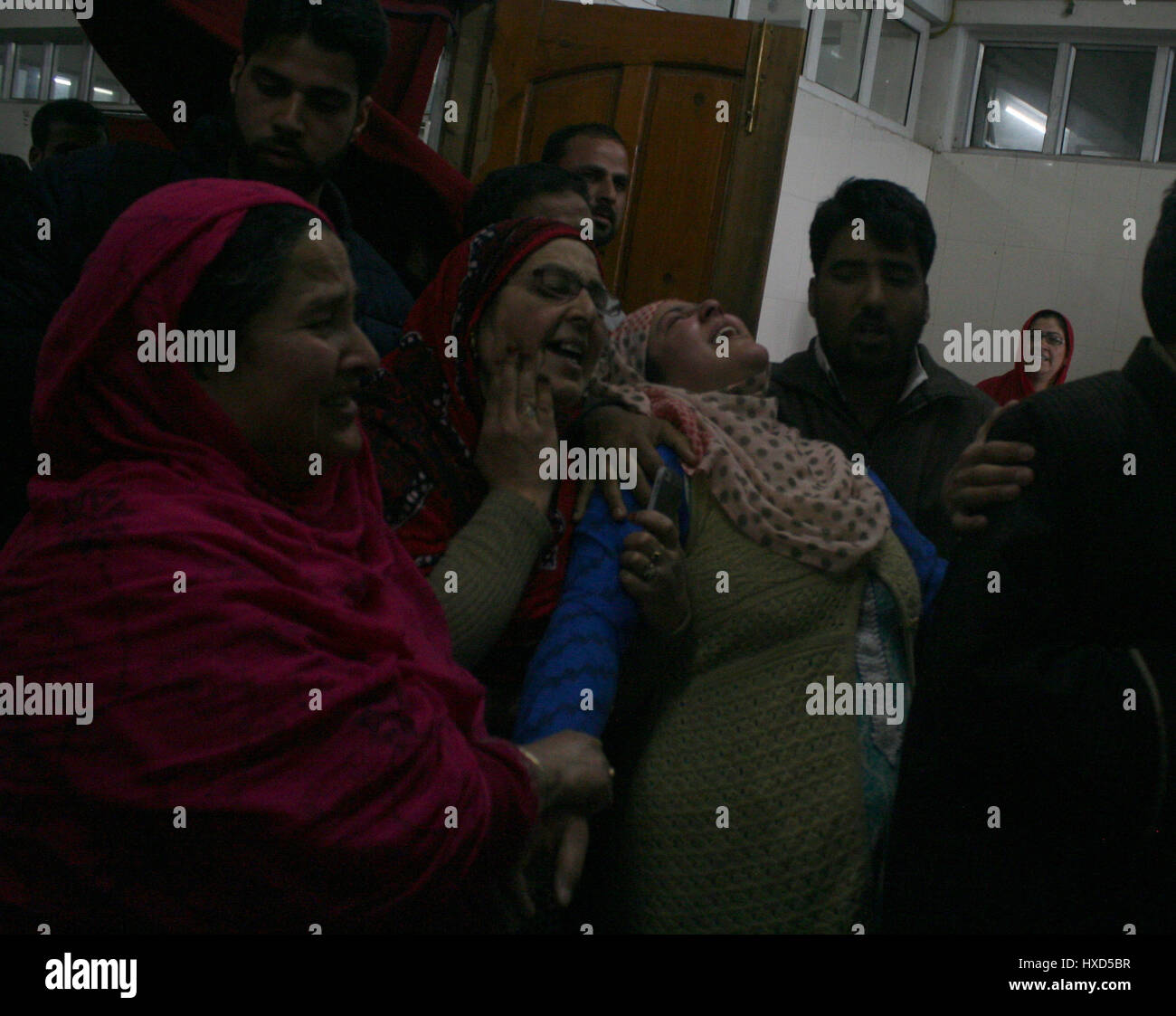 Srinagar, Kashmir. 28th March 2017.Relatives weeps in side the hospital after received the body .One person was killed and four others were injured today in security forces' action against stone-pelting protesters near the encounter site in Chadoora area of central Kashmir's Budgam district.Security forces launched a cordon and search operation in Durbugh area of Chadoora in the early hours following information about the presence of terrorists in the area, a police official said. Credit: Sofi Suhail/Alamy Live News Stock Photo