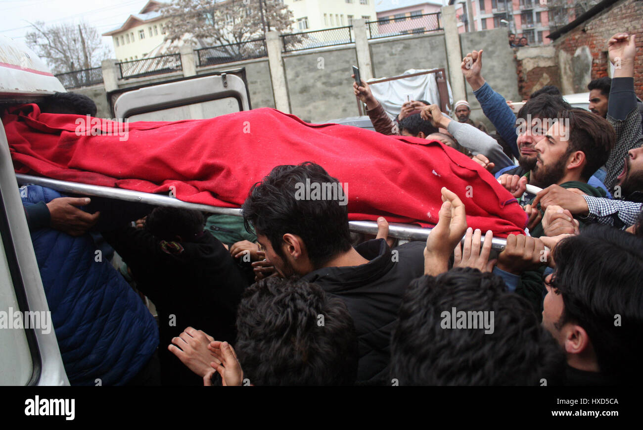 Srinagar, Kashmir. 28th March 2017.Relatives carry the body .One person was killed and four others were injured today in security forces' action against stone-pelting protesters near the encounter site in Chadoora area of central Kashmir's Budgam district.Security forces launched a cordon and search operation in Durbugh area of Chadoora in the early hours following information about the presence of terrorists in the area, a police official said. Credit: Sofi Suhail/Alamy Live News Stock Photo