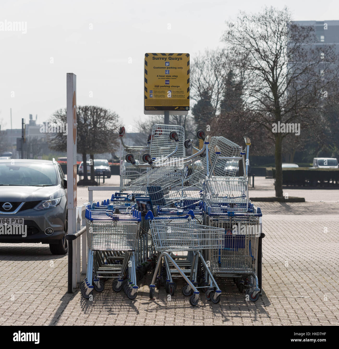 London, UK. 28th Mar, 2017. New £1 coins enter circulation, replacing the old pound. Tesco has unlocked 100,000 coin-operated trolleys after it failed to convert them in time for the launch of the new £1 coin leading to trolley vandalism. Tesco trolleys seen here in a south east London car park piled up. The introduction of the coin has also meant car parking meters and vending machines have had to be converted. Credit: Guy Corbishley/Alamy Live News Stock Photo